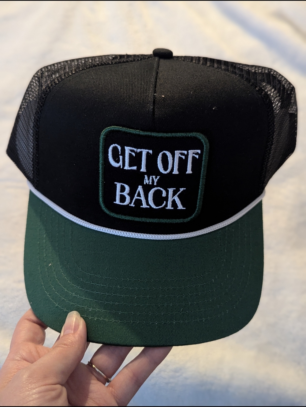 GET OFF MY BACK Black and Green Trucker Hat